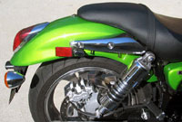The Kawasaki has a full wrap-around fender and a low-profile taillight.